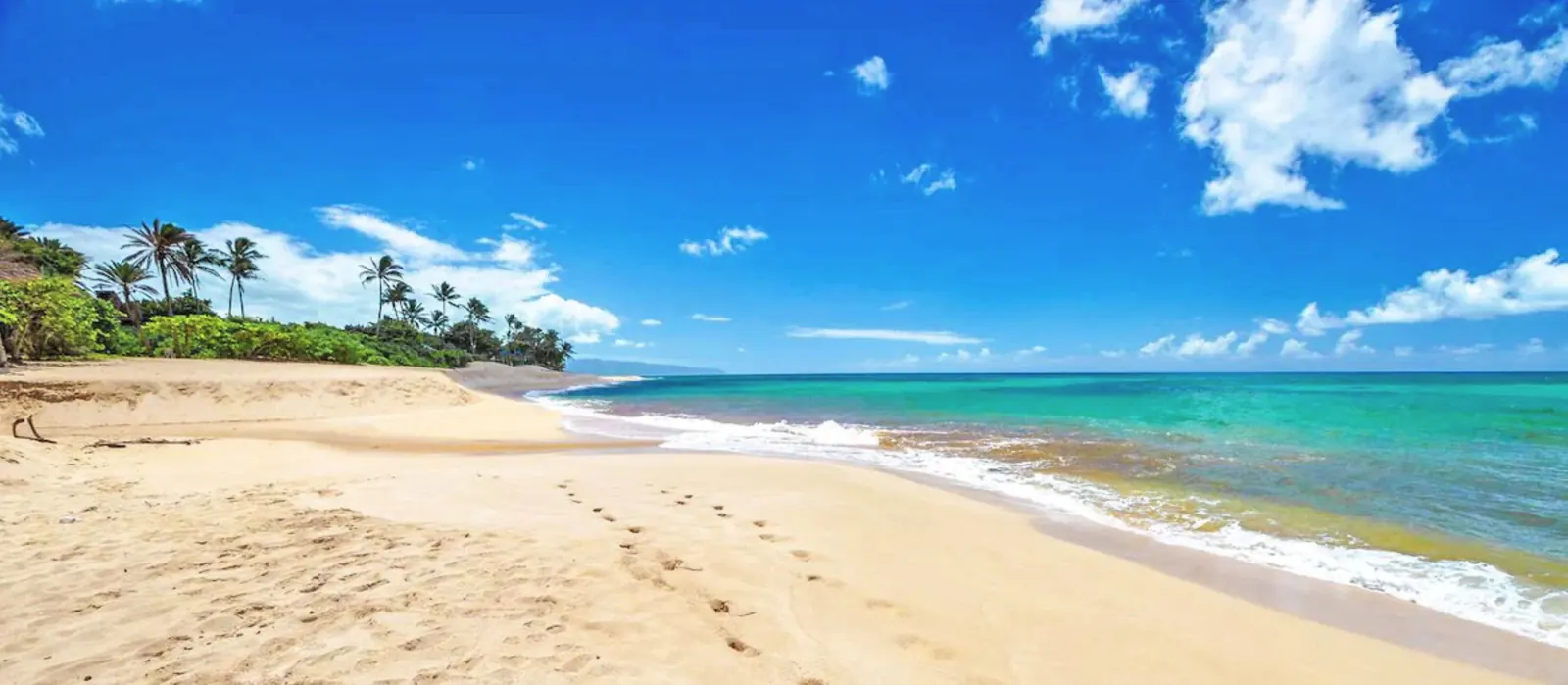 Sunset Beach on Oahu's North Shore: golden sand and turquoise water looking toward Haleiwa